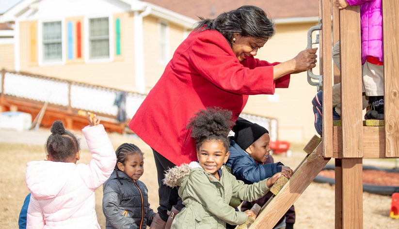 Co-owner Juanisa Kimbrough accompanies children during recreational activities at Ms. Niecy's Home Away from Home Learning Center. Photo courtesy of Access to Capital for Entrepreneurs