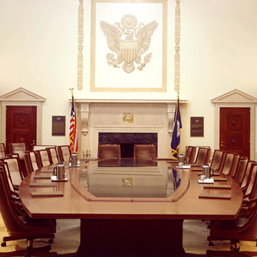 Board of Governors boardroom table viewed from the end